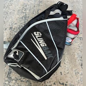 Franklin kids black tee-ball bag with 6 tee-balls included.